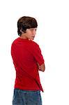 a young teen boy in a red shirt looking backward over his shoulder isolated on white