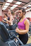 Women exercising in the gym on treadmills