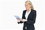 Blonde businesswoman touching on her tablet