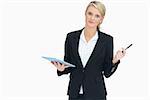 Businesswoman holding tablet and pen