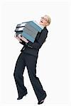 Overworked businesswoman carrying many folders