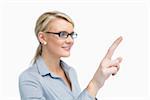 Businesswoman is showing something with her finger while wearing glasses