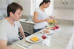 Couple having lunch in kitchen