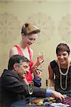 Man and women smiling at the casino table