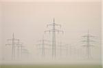 Power lines in early morning fog, Hesse, Germany, Europe