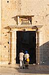 Tourist entering Old Town of Trogir through the South Town Gate, Trogir, UNESCO World Heritage Site, Dalmatian Coast, Croatia, Europe