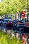 Houseboats on canal, Amsterdam, Netherlands, Europe