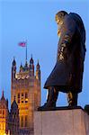 Winston Churchill statue and the Houses of Parliament at night, London, England, United Kingdom, Europe