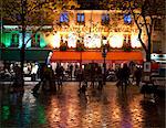 Restaurants and cafes lit at night in the Montmartre area of Paris, France, Europe