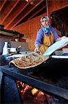 Woman making flatbread in a cafe in Antalya, Anatolia, Turkey, Asia Minor, Eurasia
