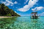 Little motor boat in the turquoise waters of the Ant Atoll, Pohnpei, Micronesia, Pacific