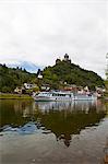 River cruise ship below castle Cochem on the River Moselle, Rhineland-Palatinate, Germany, Europe