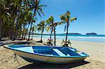 Boat on the palm-fringed beach at this laid-back village & resort, Samara, Guanacaste Province, Nicoya Peninsula, Costa Rica, Central America