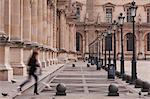 A woman walks through the Louvre Museum in Paris, France, Europe