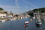Sailing yachts and fishing boats moored in Looe harbour, Cornwall, England, United Kingdom, Europe