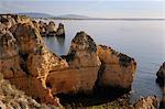 Weathered sandstone cliffs and sea stacks at Ponta da Piedade, Lagos, Algarve, Portugal, Europe