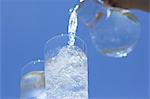 Two glasses of water and blue sky