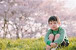 Young boy on grassland looking at camera