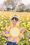 Young girl with sun shaped drawing