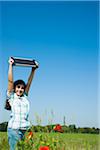 Girl Holding Solar Panel up in the Air, Mannheim, Baden-Wurttemberg, Germany