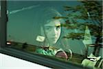 Girl in Minivan through Window, Mannheim, Baden- Wurttemberg, Germany