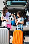 Girls Loading Luggage in Van for Vacation, Mannheim, Baden-Wurttemberg, Germany