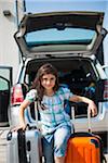 Girl Loading Luggage in Van for Vacation, Mannheim, Baden-Wurttemberg, Germany