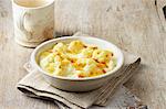 Small cauliflower cheese in white bowl