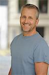 Portrait of mature man smiling, indoors