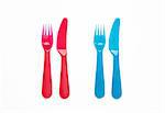 Colourful plastic knives and forks