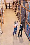 Worker and supervisor in warehouse