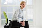 Businesswoman sitting on office chair