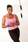 Portrait of young woman with skipping rope