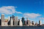 View of Manhattan skyline through netting, New York City, USA