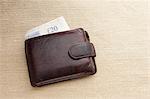 Brown leather wallet with twenty pound note