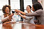 Friends toasting at wine bar