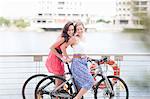 Two young women on a bicycle