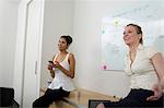 Young woman in front of whiteboard