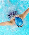 Young woman swimming in swimming pool