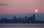 Moon over skyline, Seattle, USA