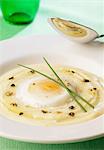 Soft-boiled egg with mashed poatoes and shredded truffles
