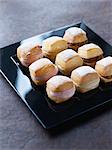 Tray of mini bread sandwiches for a cocktail by Dalloyau