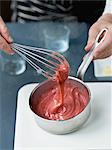 Mixing the strawberry confectioner's cream with a whisk