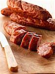 Slicing Chorizo sausages