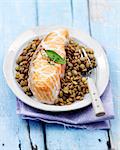 Salmon wrapped in caul with lentils