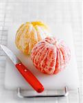 Peeled grapefruit and orange