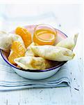 Clementine and chocolate nems with citrus fruit sauce