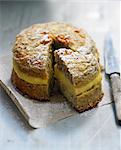 Bitter almond cake with orange cream filling