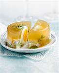 Hard-boiled egg in aspic with fromage frais and herbs
