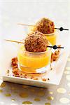 Cream of carrot soup with foie gras balls coated in crumled gingerbread